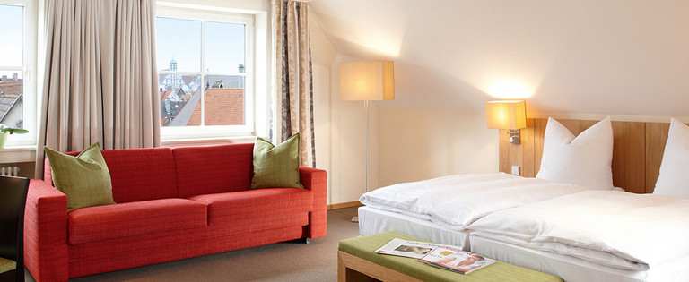 Stylish rooms for two at the centrally located four-star Hotel Falken